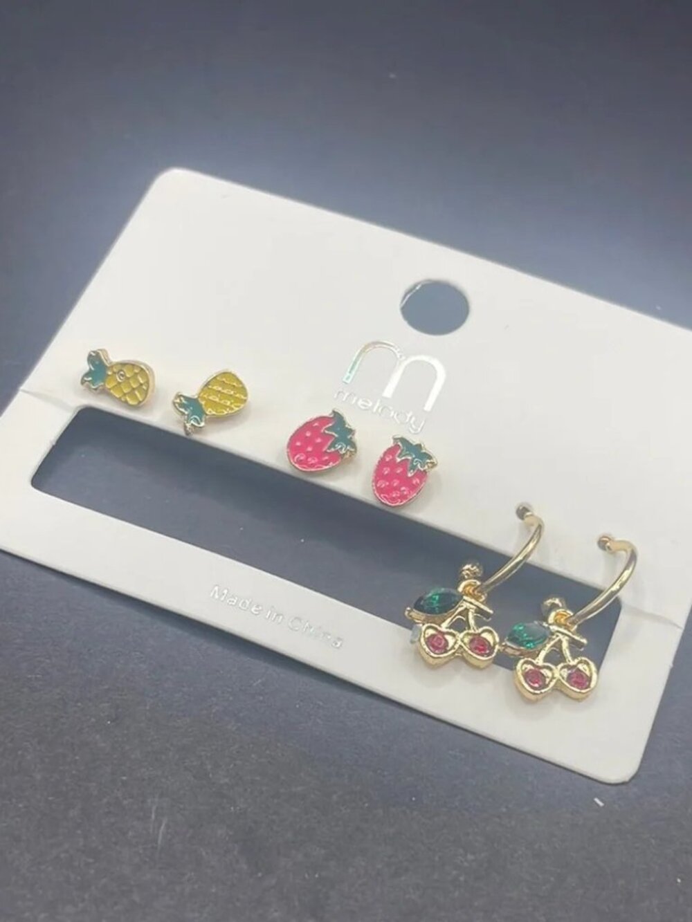 Melody 3-pack fruit-themed pineapples, strawberries, and cherries earrings. New